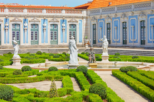 Visit to the gardens and fountains of Queluz National Palace in Lisbon, Portugal during sunny weather
