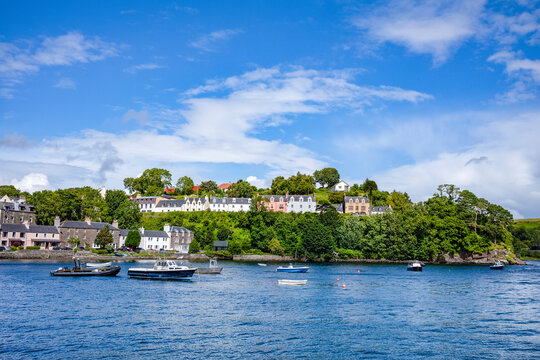 Waterfront and harbour at Portree with boats and buildings along the Isle of Skye in Scotland