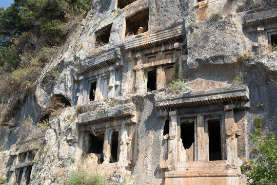 Rock tombs from ancient Telmessos carved into cliffs between 522 and 486 BC in Fethiye Turkey showing historical architecture and craftsmanship
