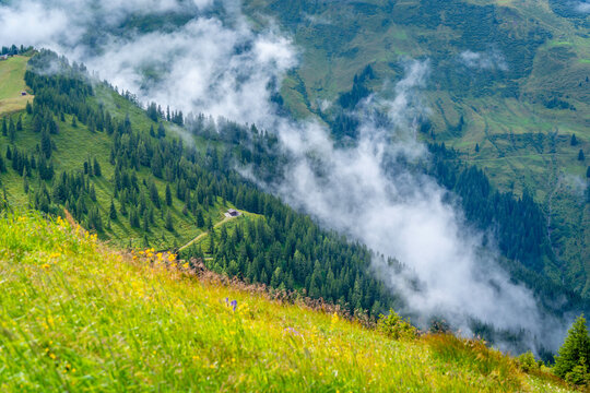 View of mountains and clouds from Schmittenhohebahn top station in Zell am See, Salzburg, Austria on a sunny day
