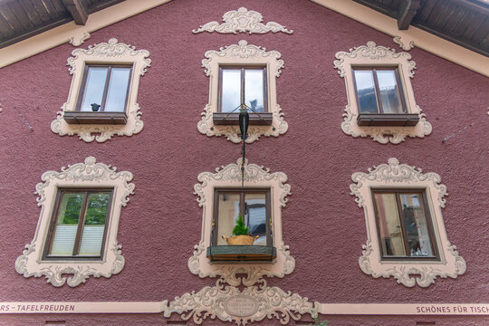 Bright colors on the facade of a chalet in Saalfelden, Salzburg, create a lively scene on a sunny day in Europe