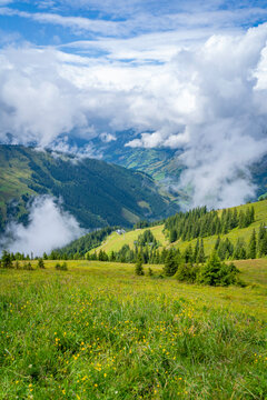 View of mountains and clouds from Schmittenhohebahn top station at 2000 meters in Zell am See, Salzburg, Austria on a sunny day