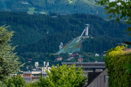 View of Bergisel Ski Jump in summer with clear sky and surrounding landscape in Innsbruck, Tyrol Region, Austria