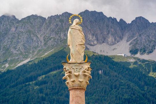 View of Virgin Mary on Annasule surrounded by mountains in summer in Innsbruck, Tyrol Region, Austria