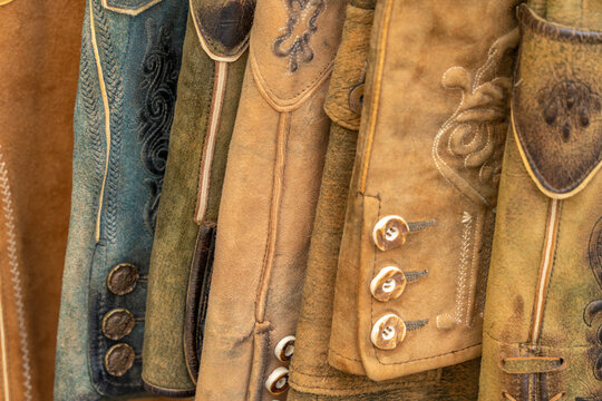 View of traditional leather jackets displayed in old town streets of Kitzbuhel, Austrian Tyrol, showcasing craftsmanship and culture