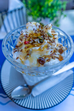 Delicious Greek yoghurt with honey and seeds served in a bowl in Heraklion on the Greek Islands