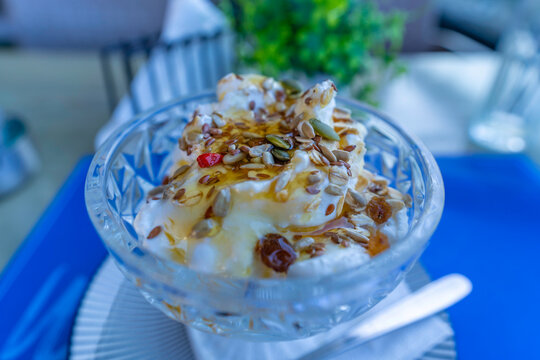 Traditional Greek yoghurt with honey and seeds served in a bowl from the City of Heraklion in Crete