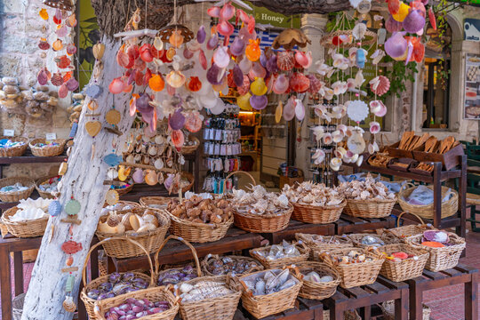 Souvenir shop displays items in Limenas Chersonisou Crete with various shells and handmade crafts for visitors