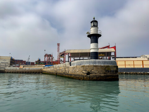 Lighthouse stands at the entrance of Callao Harbor in Lima, Peru, guiding ships since 1537 in the Pacific Ocean