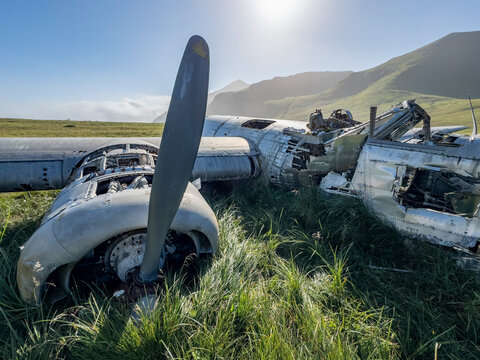 Grounded B-24 Liberator bomber wreckage rests in Bechevin Bay after running out of fuel during WWII in Atka Island, Alaska