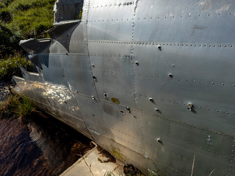 Detail of grounded B-24 Liberator bomber with corrosion and damage, Bechevin Bay, Atka Island, Alaska
