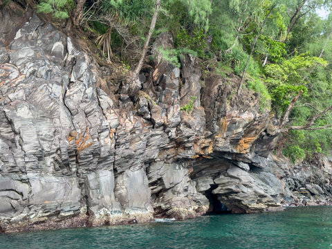 Exploring Gunung Api point with lava formations from the 1998 volcanic eruption in Banda Neira, Moluccas, Indonesia