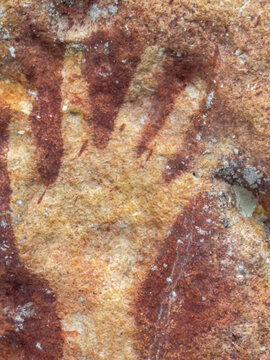Ancient rock art raising awareness of cultural history in Berau Bay of Papua Indonesia