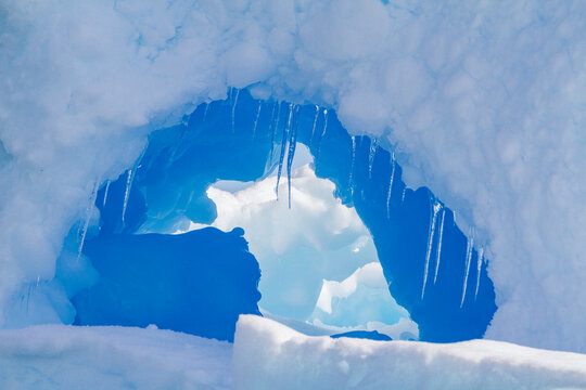Detail of an iceberg with blue hues around the Antarctic Peninsula during the Austral summer months in Antarctica