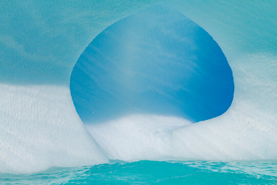 Detail of ice structure with blue hues in Antarctica during Austral summer months near Antarctic Peninsula