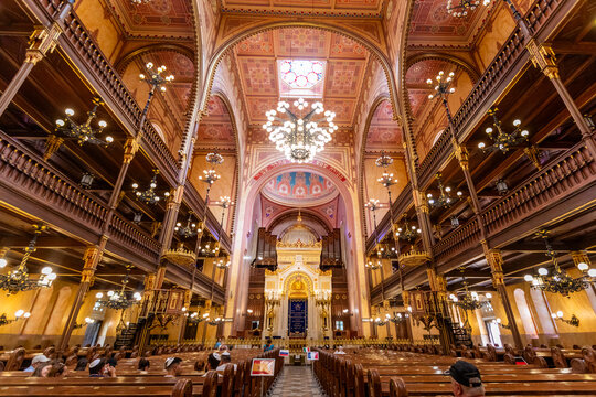Wide-angle view of the interior of Dohny Street Synagogue showing the ark and chandeliers in Budapest Hungary