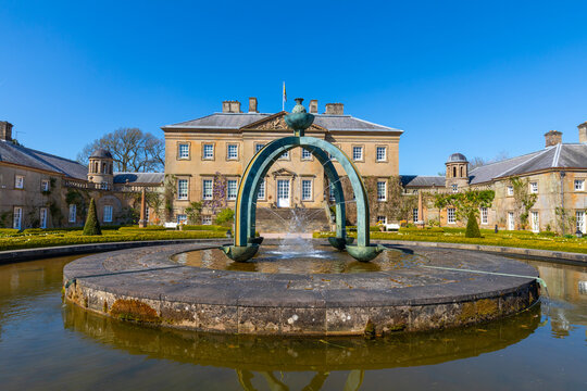 Dumfries House with Mahtouz fountain and garden features in Cumnock, East Ayrshire, Scotland, during clear weather