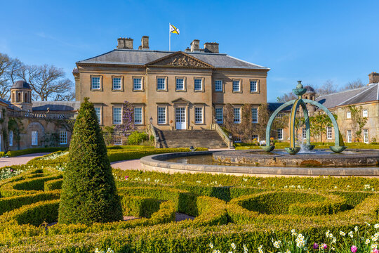 Dumfries House features the Mahtouz fountain and garden in Cumnock, highlighting the lush greenery and historic architecture of Scotland