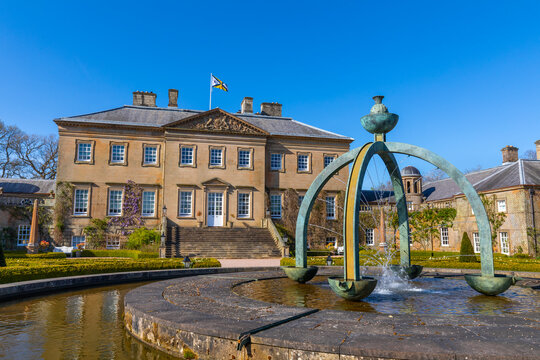 Dumfries House features Mahtouz fountain in garden setting near Cumnock in East Ayrshire in Scotland during clear weather