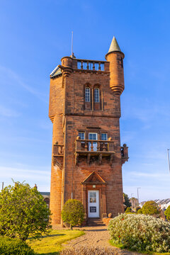 National Burns Monument in Mauchline shows historic architecture under clear sky in East Ayrshire, Scotland