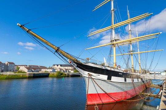 Glenlee Tall ship at Riverside Museum docked in Glasgow under clear skies in the United Kingdom