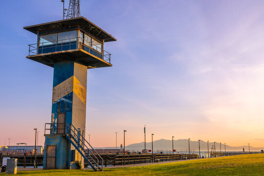 Harbour control tower with Isle of Arran in background at Ardrossan, North Ayrshire, Scotland during sunset