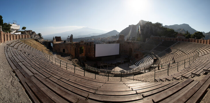 Empty white banner displayed in ancient theatre at sunset in Sicily near Taormina