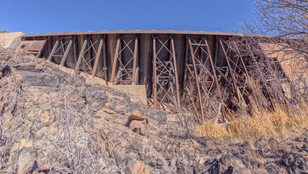 View from below Bainbridge Steel Dam in Ash Fork Arizona highlights the structure and materials used in its late 1800s construction