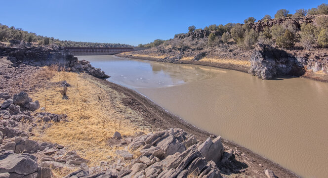 Historic Bainbridge Steel Dam view along the shoreline in Kaibab National Forest near Ash Fork Arizona