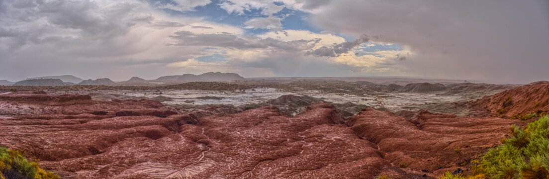 Heavy rainstorm over Flattops section of Petrified Forest National Park in Arizona captures falling rain in landscape