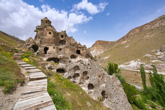 Exploring Soganli ancient houses carved in rock in Cappadocia, Turkey with multiple levels and a unique historical charm
