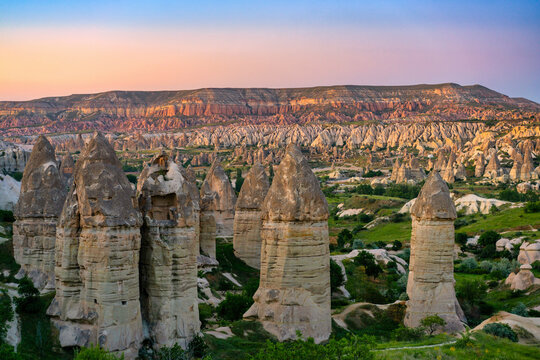 Rock formations in Rocket Valley with Red and Rose Valley at sunset in Cappadocia, Turkey near Goreme