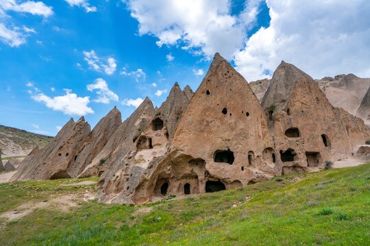 Exploring ancient rock-carved houses in Cappadocia, Turkey with unique geological formations