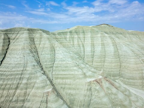 Drone view of grey mountains in dry landscape of Turkey highlighting natural formations and terrain features