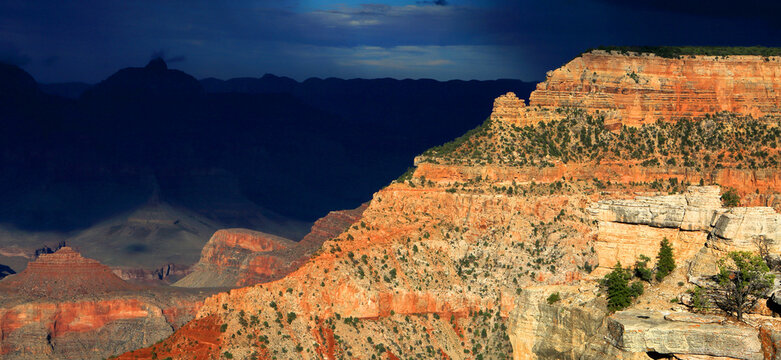Exploring the vast landscape of the Grand Canyon from the South Rim during an overcast day