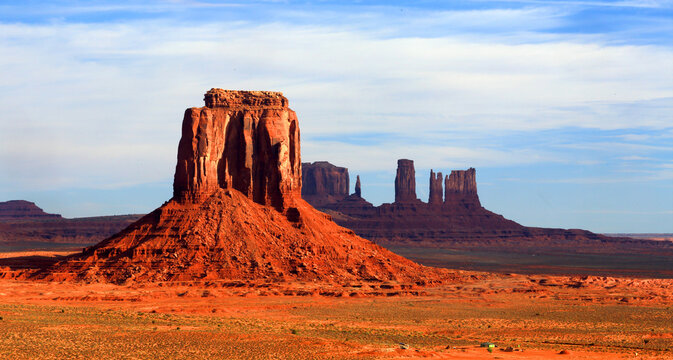 Exploring Monument Valley with its iconic buttes and wide open landscape in Navajo Indian Territory Utah during daytime