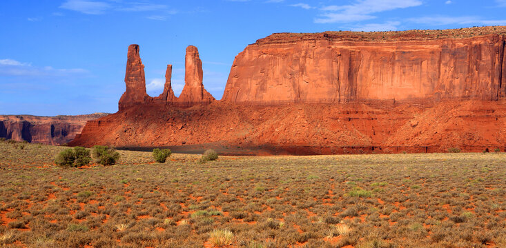 Monument Valley showcases red rock formations and open landscapes in the Navajo territory of Utah, USA under clear skies