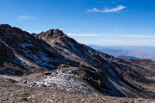 Ruins of a high-altitude building in snow at Sierra Nevada National Park in Spain