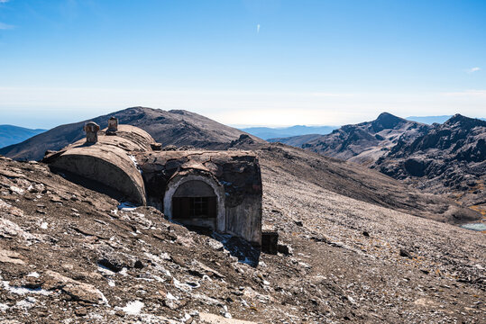 Weathered mountain hut on Sierra Nevada high plateau showing history of mountaineering in Spain