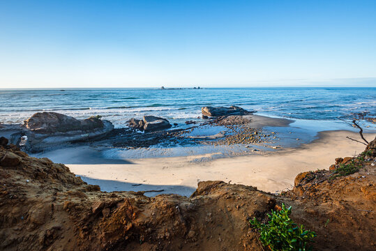 Exploring tidal rocks and golden sand along the West Coast of New Zealand's South Island at Cape Foulwind