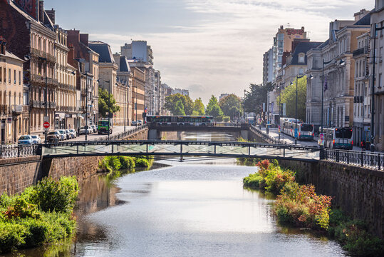 River Vilaine flows through city center of Rennes with historic bridges and traditional architecture in Brittany France