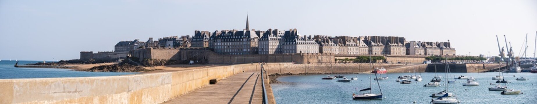 Panoramic view of Saint-Malo harbor and walled city from Mle des Noires pier in France