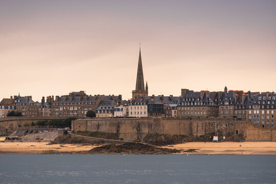 View of the Saint Malo old town skyline with the Saint Vincent Cathedral spire above the medieval city walls in Brittany France