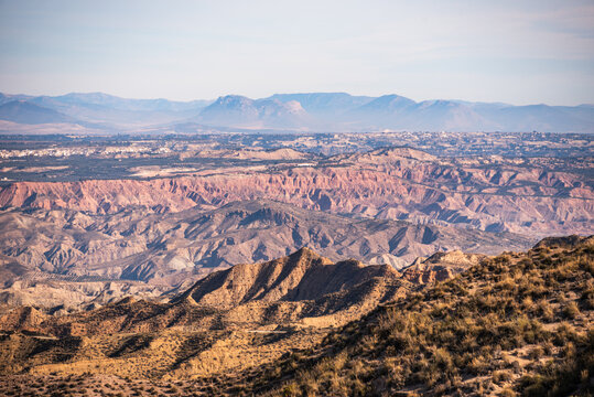 View over the eroded canyons and rugged terrain in the Desierto de Gorafe, Granada, Spain