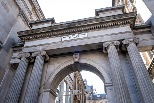 Grand arch at Royal Exchange Square features Victorian stonework and historic 19th-century design located in Glasgow, Scotland