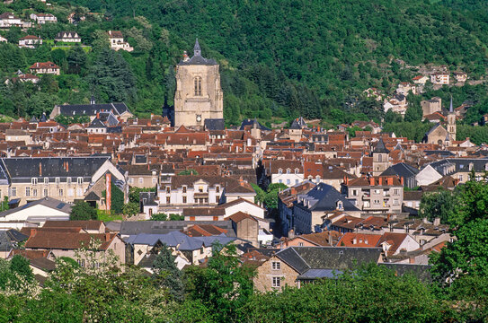 View of Villefranche-de-Rouergue with historic buildings and greenery in Aveyron region of France