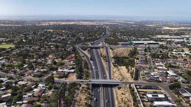 Southern Expressway, South Adelaide, South Australia: 4K aerial footage of highway traffic, road interchange, moving vehicles, urban transport in Hackham West, Noarlunga, Morphett Vale, Christie Downs