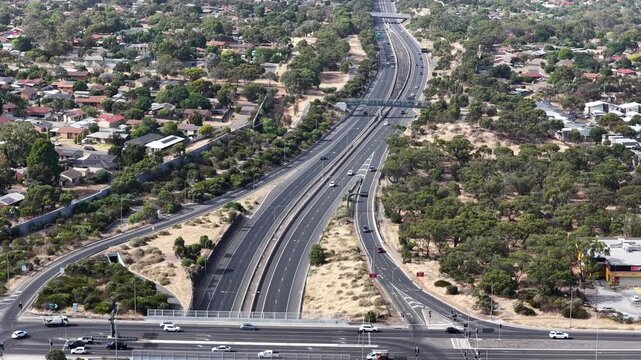 Southern Expressway, South Adelaide, South Australia: 4K aerial footage of highway traffic, road interchange, moving vehicles, urban transport in Hackham West, Noarlunga, Morphett Vale, Christie Downs