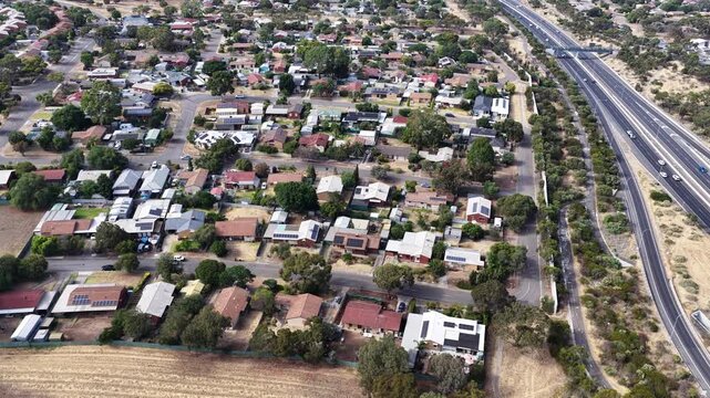 Hackham West, South Adelaide, South Australia: 4K aerial footage of residential suburb, houses, estates, streets, highways, traffic, urban infrastructure, near Noarlunga, Morphett Vale, Christie Downs