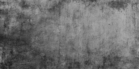 Obraz premium A dark aged stone surface with a vintage gray grunge wall texture creates an old rough concrete backdrop featuring a dirty black paint pattern and antique paper design